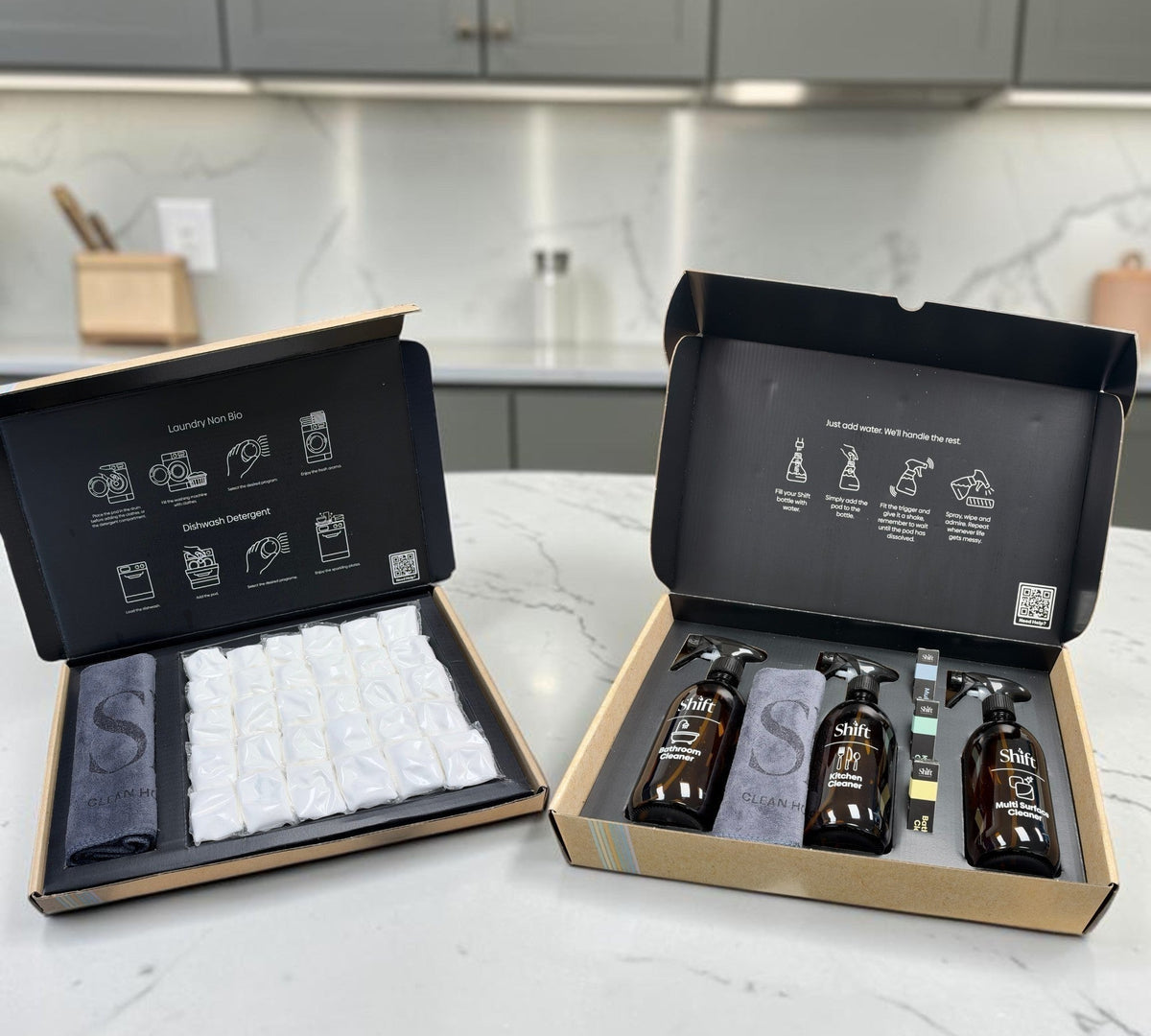 Shift The Full Shift cleaning kit featuring refillable glass spray bottles, cleaning pods, and microfiber cloths.